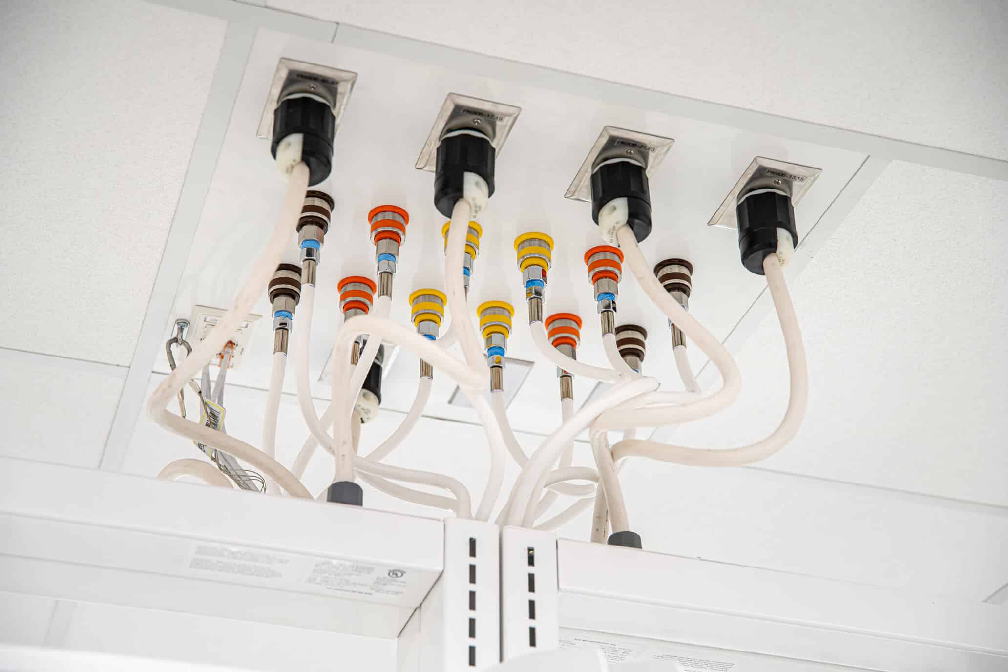 Overhead service panels carriers for labs